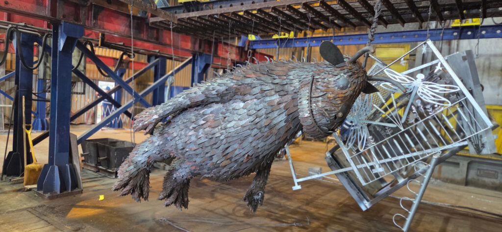 a metal work gruffalo sculpture hands at an angle ready to be hot dip galvanised